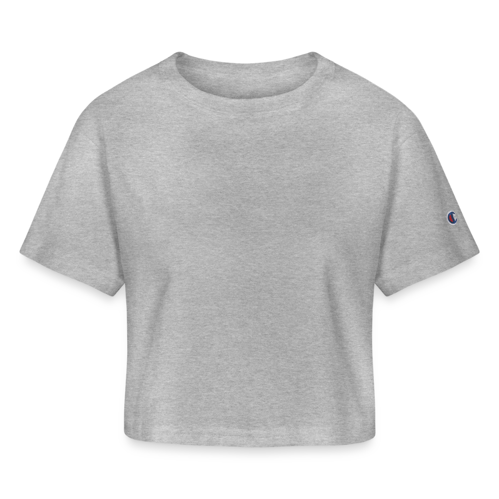 A chic cropped White T-shirt in a versatile heavyweight 100% cotton fabric (7 oz), featuring stylish oversized sleeves and a slightly cropped cut for a modern look. The shirt includes a 1-inch bound ribbed collar for structure and comfort, with the iconic Champion "C" patch logo on the left sleeve. Perfect for pairing with jeans, skirts, or statement accessories, this effortlessly stylish top is designed to elevate any casual or dressed-up outfit. Imported, printed, and processed in the USA.