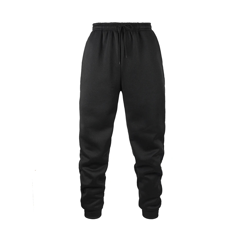 Men's black fleece jogger sweatpants in soft polyester fabric with an elastic waistband and tapered cuffs. Designed for movement with moisture-wicking performance, ideal for workouts, lounging, or everyday wear.
