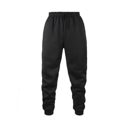 Men's black fleece jogger sweatpants in soft polyester fabric with an elastic waistband and tapered cuffs. Designed for movement with moisture-wicking performance, ideal for workouts, lounging, or everyday wear.