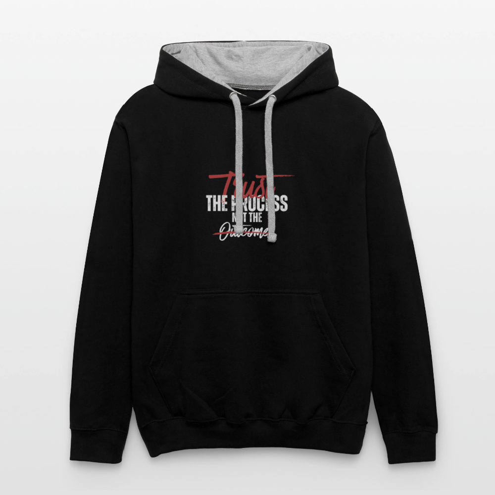 A unisex black/gray contrast hoodie featuring a double-layered hood with a bold contrasting inner fabric and matching flat lace drawcords. The front displays a motivational print reading "Trust the Process Not the Outcome" in a clean, modern font. Made from a soft 80% cotton/20% polyester blend (8.3 oz midweight fabric), it has ribbed cuffs and hem for a snug fit. Designed for tag-free comfort with a tear-out label, this stylish pullover by ADON LUXE is perfect for everyday wear. 