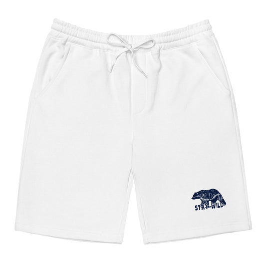 Men's white fleece lounge shorts with elastic drawstring waist, jersey-lined pockets, and tapered knee opening, shown flat to highlight sewn fly detail.t mockup